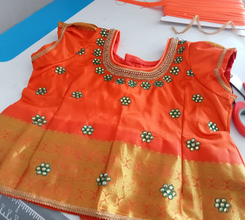 Student-stitched blouse design at Rose Fashion School