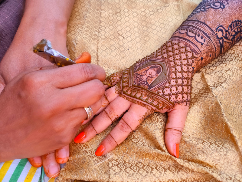 Students learning Mehndi art and henna designing at Rose Fashion School Chennai