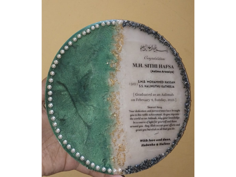 Finished resin art projects and decorative items created by students