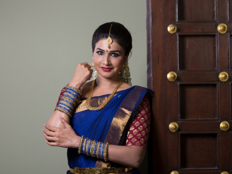 Various saree draping styles demonstrated by students at Rose Fashion School